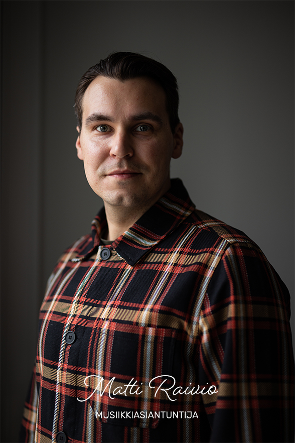 Young man wearing a sleek chequered collar shirt, looking professional. At the bottom of the image there is a text: 