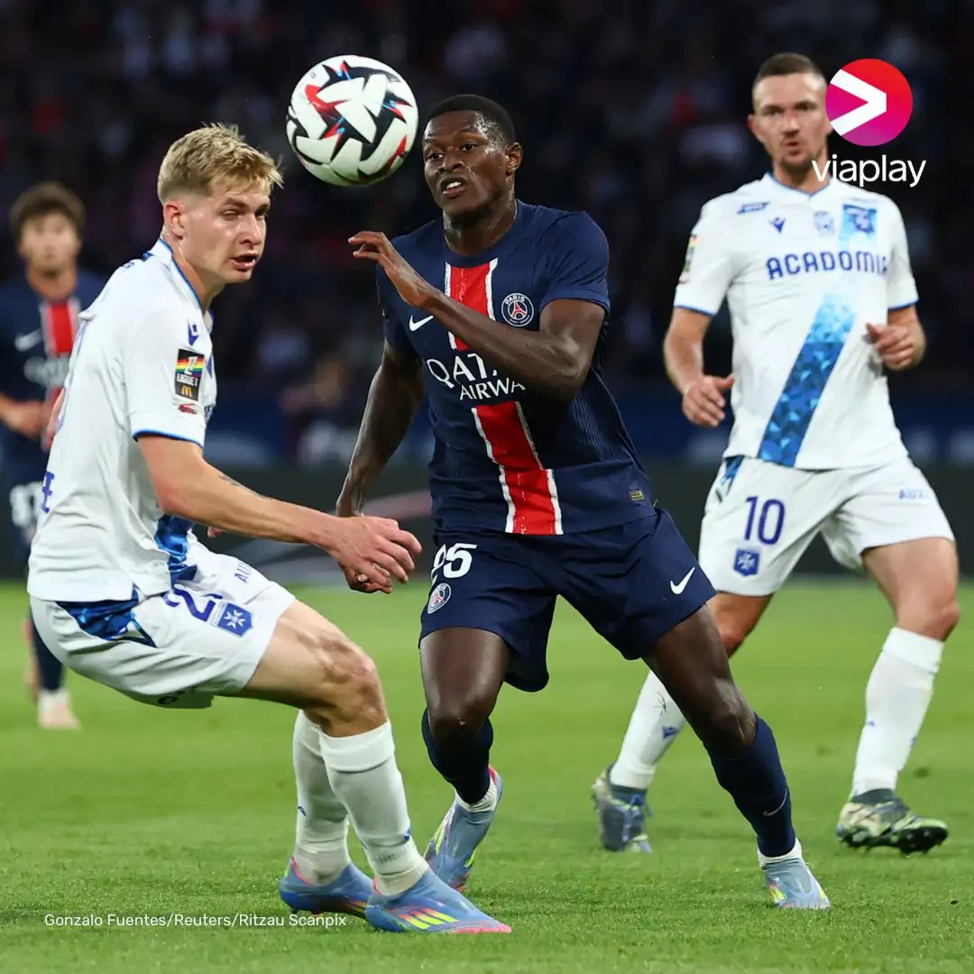 Soccer players in action on the field.