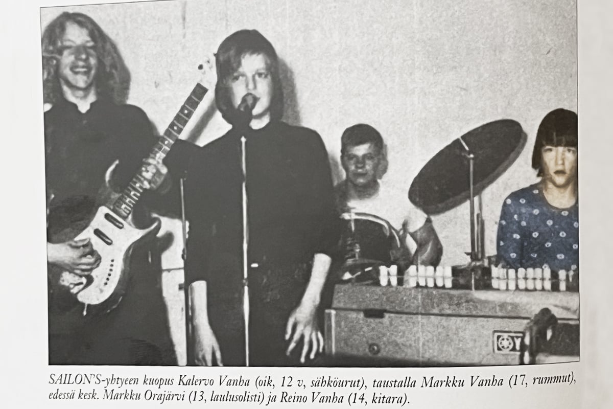 Sailon's old gig image. Four young teenagers playing various instruments. 