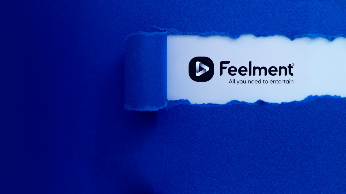 A sheet of paper with the torn piece revealing the Feelment logo.