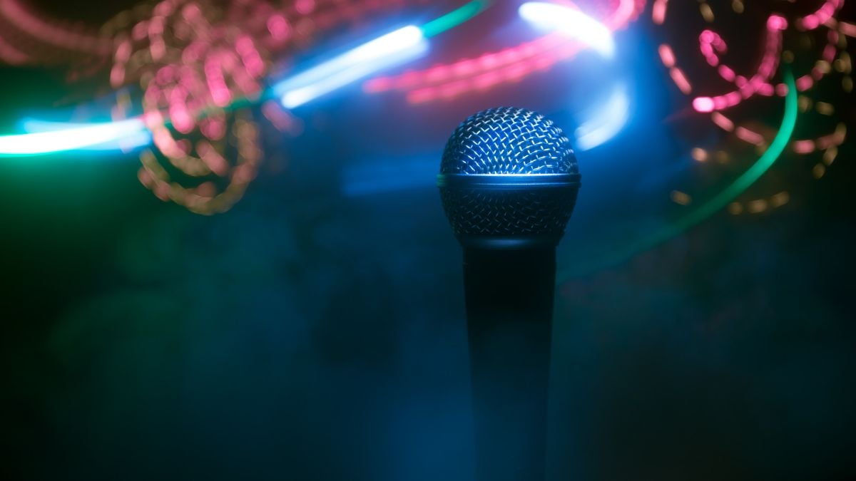 A microphone with light strips in the background.