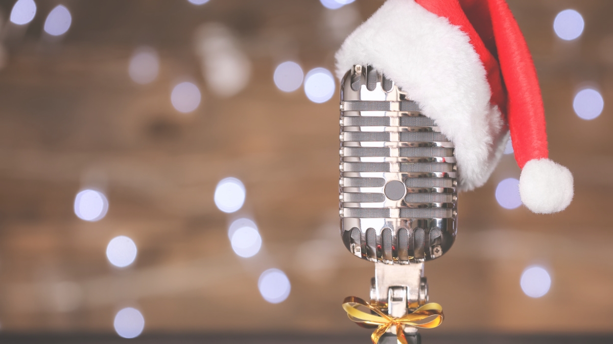 A microphone with a Santa hat on top.