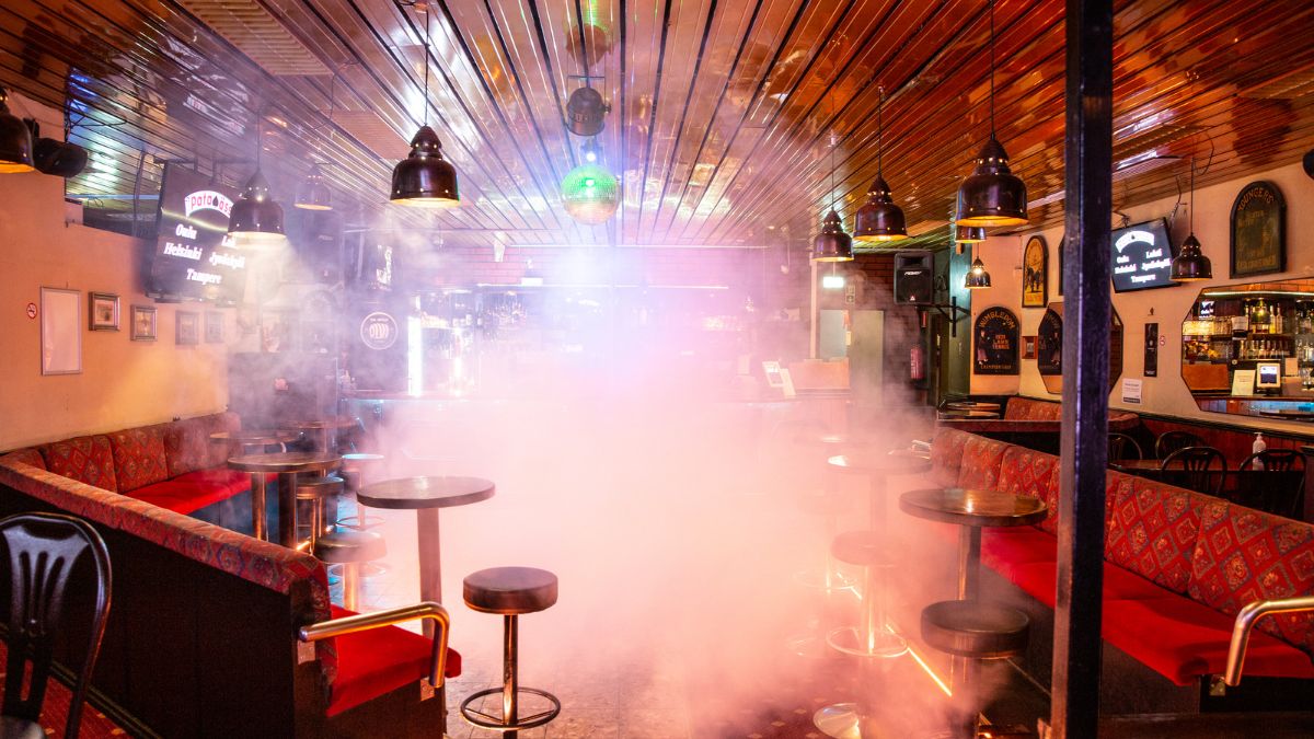 The interior of Restaurant Kuparikulma. Warm lighting and smoke on the dance floor.