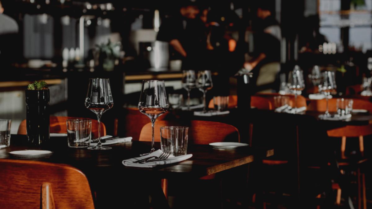 Neatly set tables inside a restaurant.