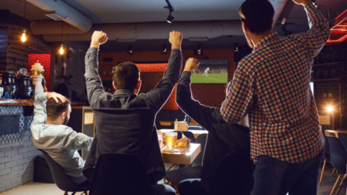 People watching sports in a restaurant.