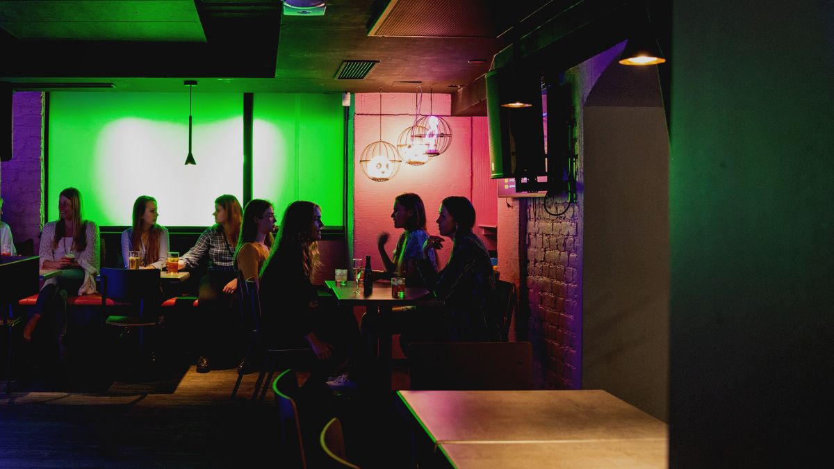 People sitting at a restaurants tables.