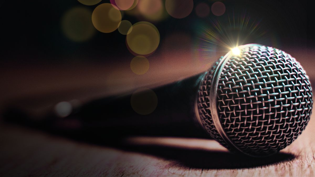 Microphone on a wooden table.